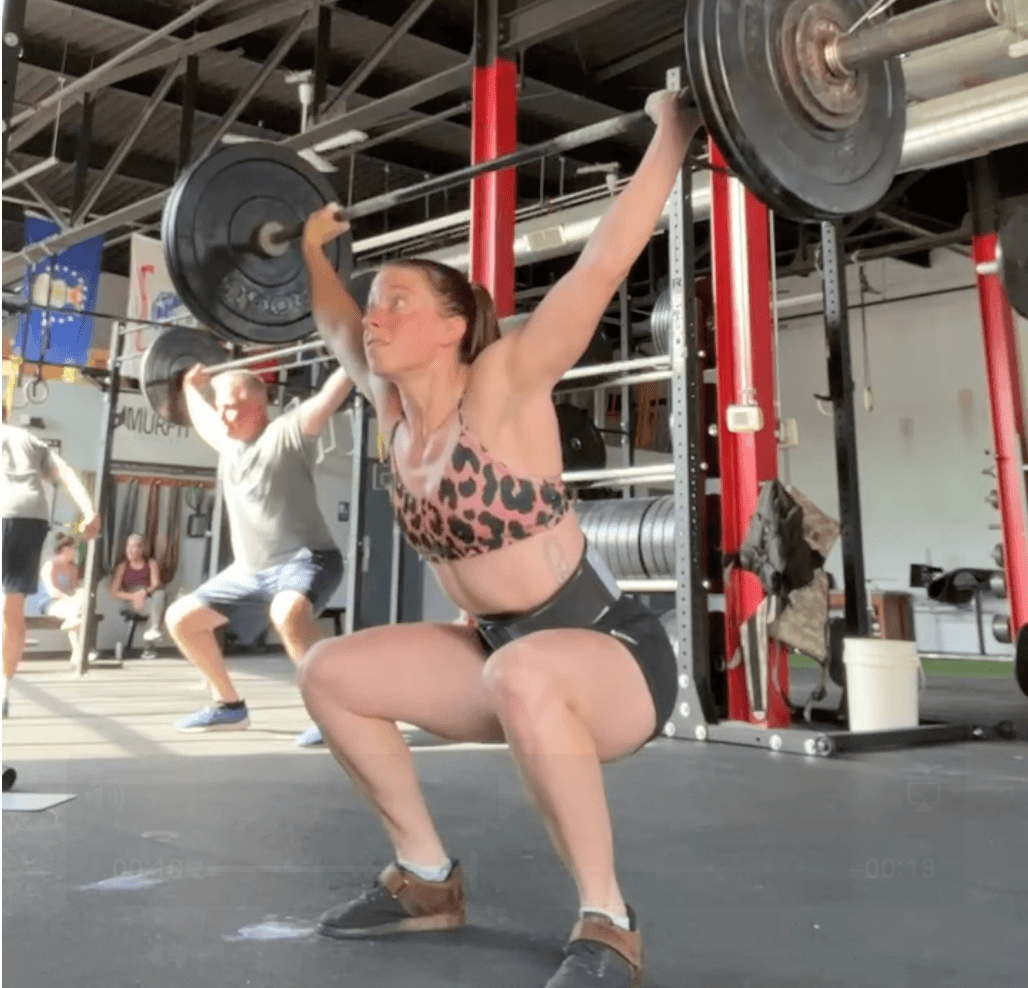 Jen olympic lifting at the gym.